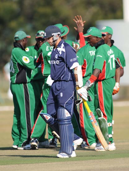 The Kenyan team celebrate as Scotland's Kyle Coetzer is dismissed for 16 runs (Photo: Ian Jacobs)