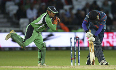 Dhoni whips off the bails (©ICC)