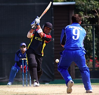 Kila Pala drives the ball to the boundary