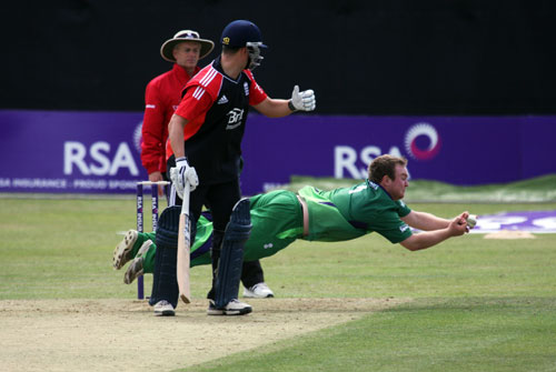 Paul Stirling takes a brilliant caught and bowled to dismiss Eoin Morgan (©CricketEurope)