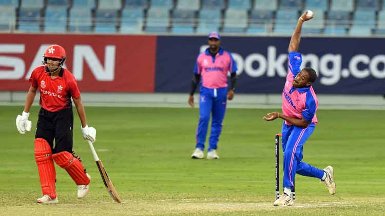 Malachi Jones bowling for Bermuda against Hong Kong