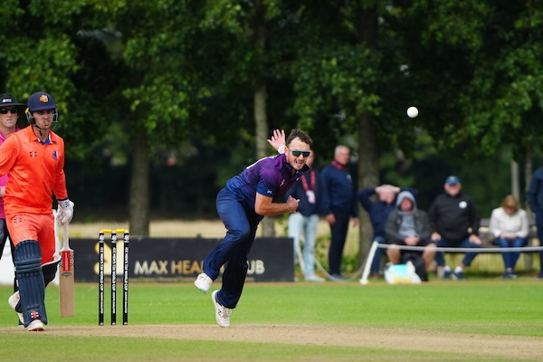 Chris Greaves bowling for Scotland