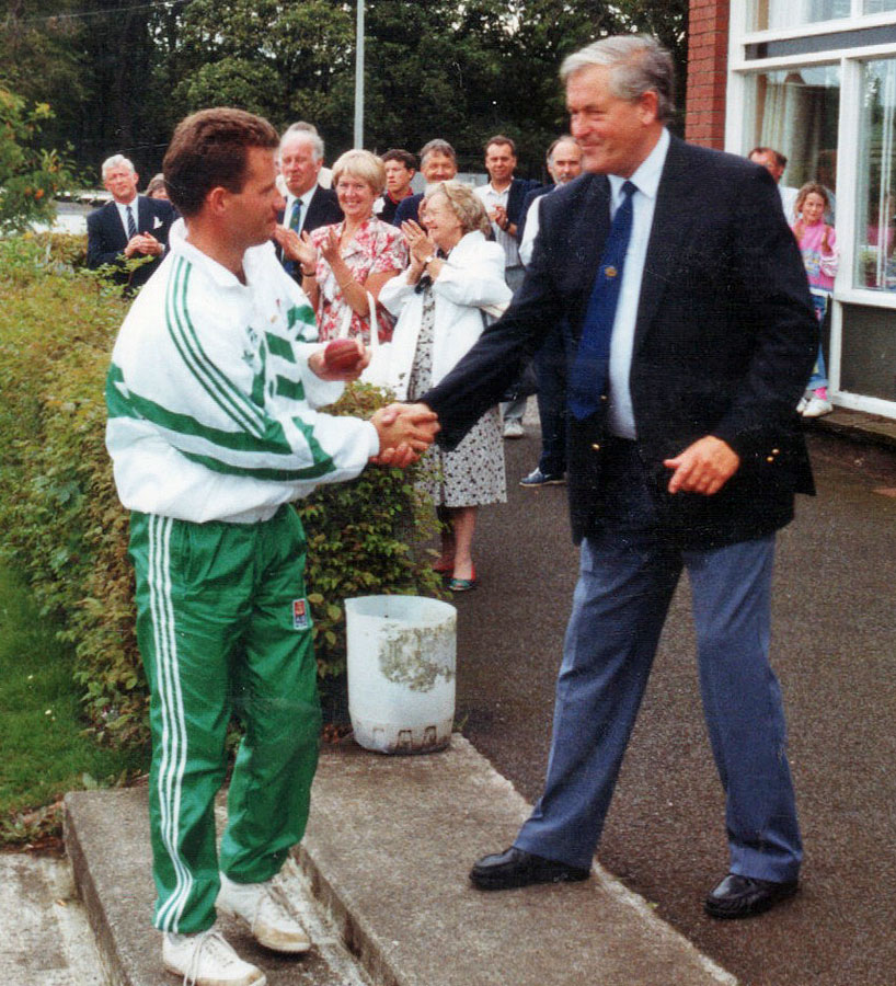 Garfield Harrison receives the Man of the Match award from SCU President Doug Lawrence (©CricketEurope)