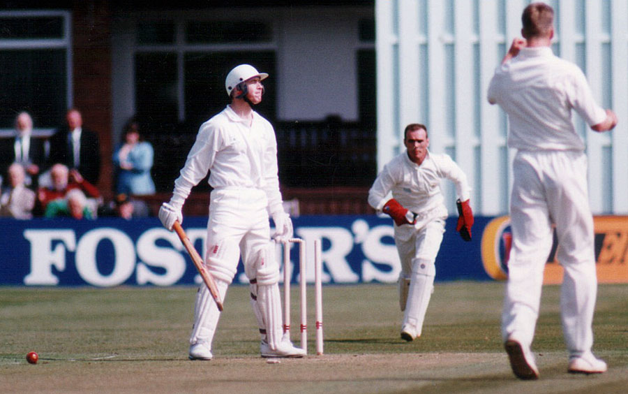Desmond Curry is bowled by Alan Mullaly (©Andy Gatling)
