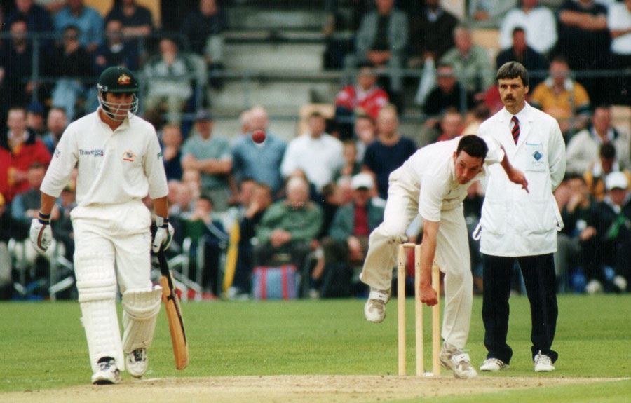 Adrian McCoubrey bowling (©Rowland White)