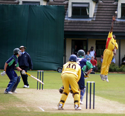 The Ugandan bowler gets off the ground (©CricketEurope)