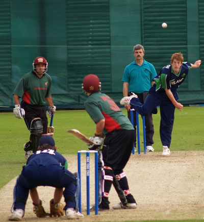 Greg Thompson of Lisburn, bowling for Ireland (©CricketEurope)