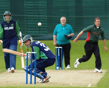 Conor Armstrong ducks under a bouncer (©CricketEurope)